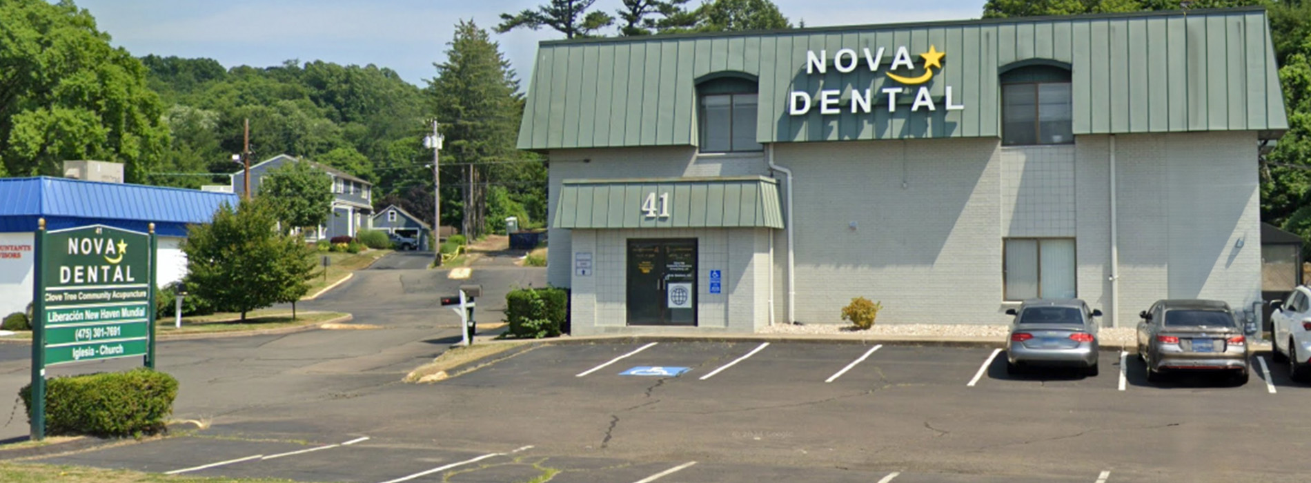 The image depicts a dental clinic named  Nova Dental  with a sign indicating its name.